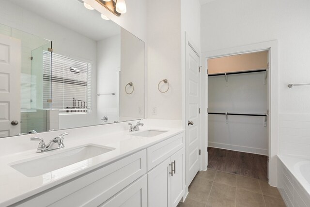 bathroom with vanity, separate shower and tub, and tile patterned floors