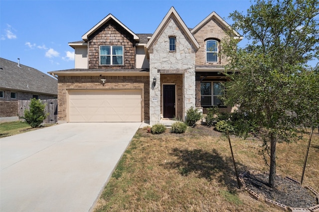 view of front of property featuring a front yard and a garage