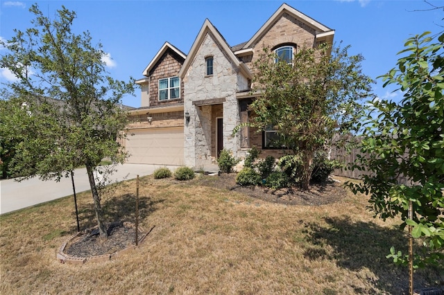 view of front of property featuring a front yard and a garage