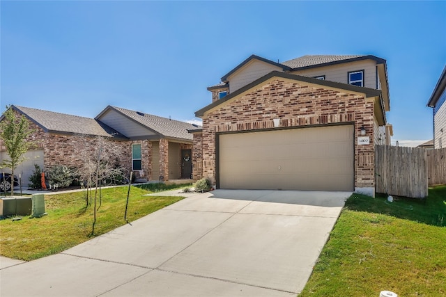 view of front property with a garage and a front lawn