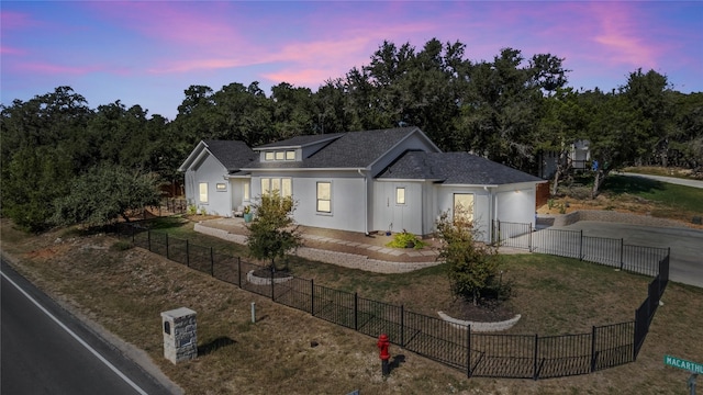 view of front of house with a lawn