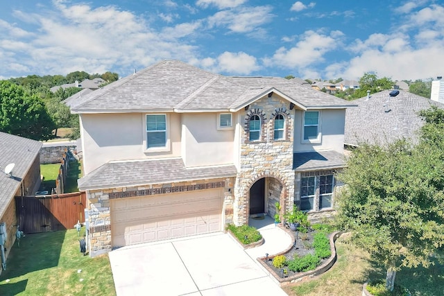 view of front property with a garage and a front lawn