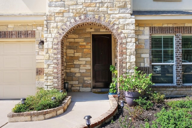 entrance to property featuring a garage