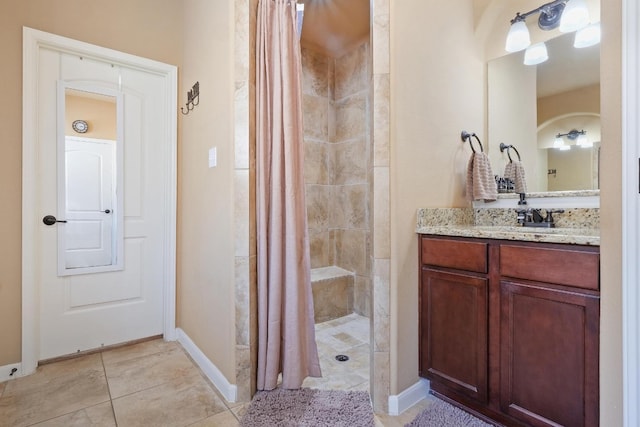 bathroom featuring tile patterned floors, a shower with shower curtain, and vanity