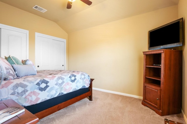 carpeted bedroom featuring ceiling fan and vaulted ceiling