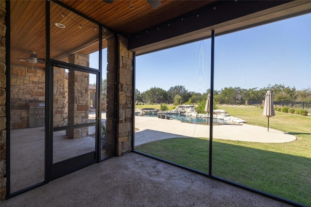 unfurnished sunroom featuring wood ceiling