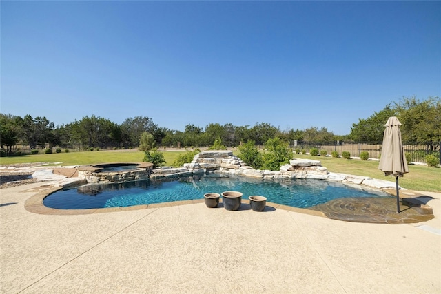 view of pool featuring a yard, a pool with connected hot tub, fence, and a patio