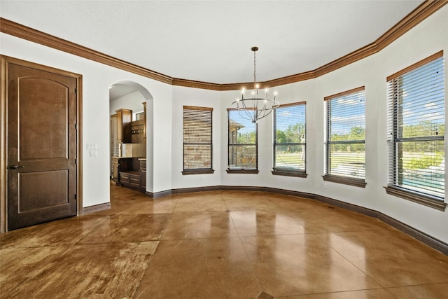 unfurnished dining area with a notable chandelier, ornamental molding, plenty of natural light, and baseboards