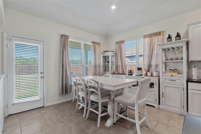 tiled dining area with a healthy amount of sunlight