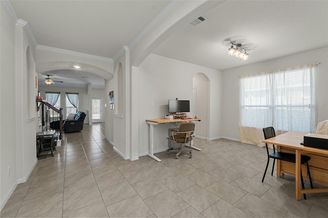 tiled home office featuring plenty of natural light, crown molding, and ceiling fan