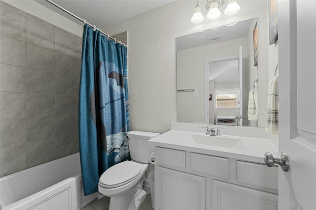 full bathroom featuring vanity, shower / tub combo, toilet, and a textured ceiling