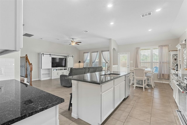 kitchen with white cabinets, sink, a wealth of natural light, and ceiling fan