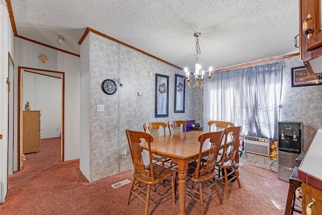 carpeted dining space featuring a notable chandelier, crown molding, a wall unit AC, and a textured ceiling