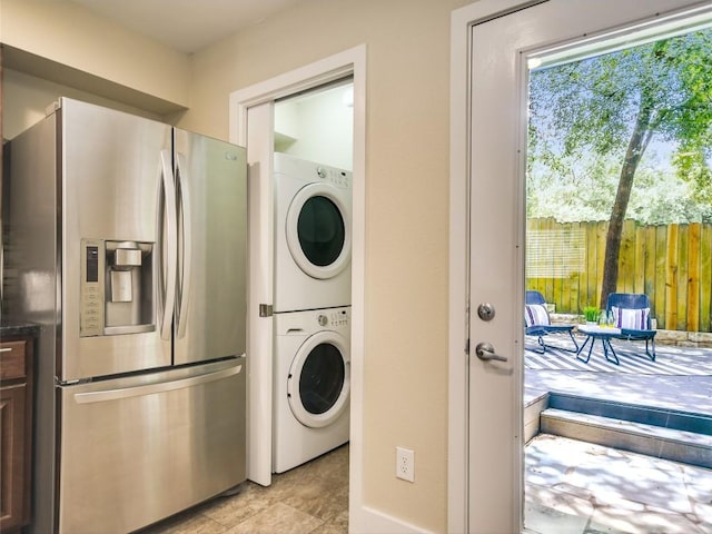 3601 Menchaca Rd Unit 109, Austin, TX 78704 - clothes washing area with stacked washer and dryer and laundry area