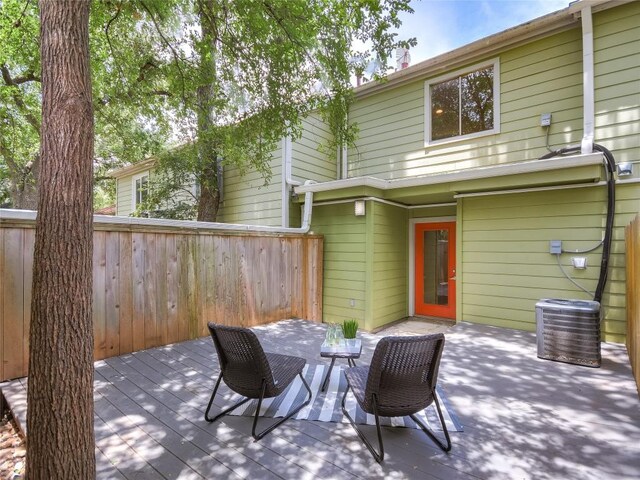 3601 Menchaca Rd Unit 109, Austin, TX 78704 - exterior space featuring fence, central air condition unit, and a wooden deck