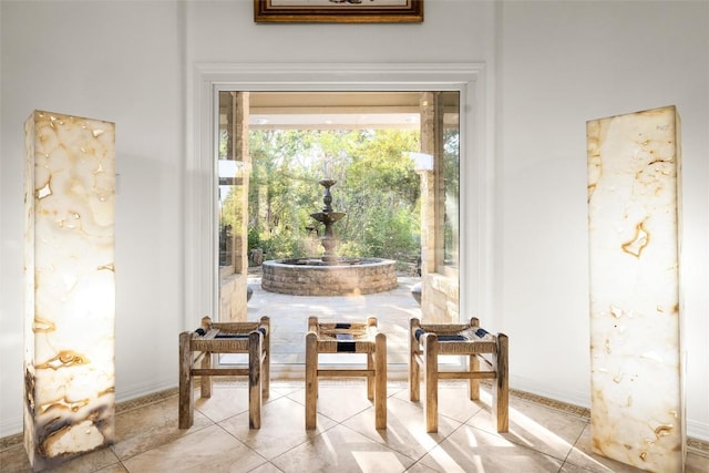 interior space featuring light tile patterned floors and baseboards