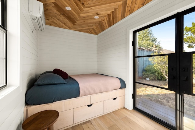 bedroom with wood ceiling, an AC wall unit, wooden walls, and light wood finished floors