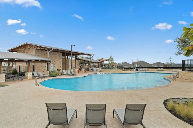 319 Victoria Peak Loop, Dripping Springs, TX 78620 - community pool with fence and a patio area