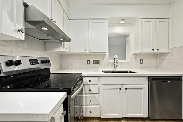 kitchen featuring appliances with stainless steel finishes, sink, and white cabinetry