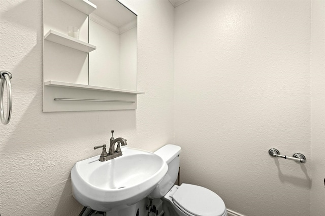 bathroom with sink and toilet