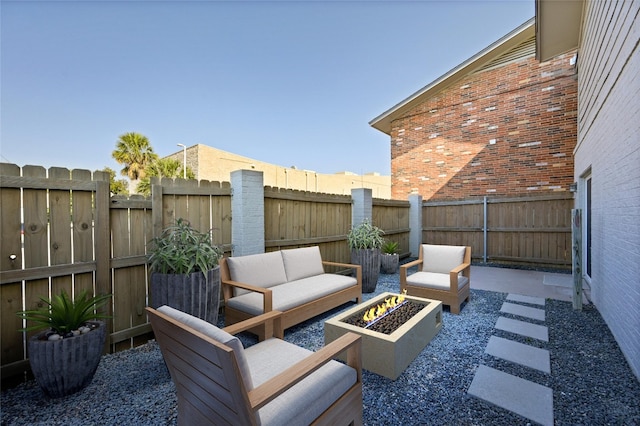 view of patio / terrace featuring an outdoor living space with a fire pit