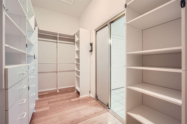 spacious closet featuring hardwood / wood-style flooring