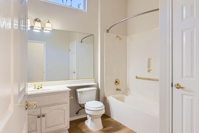 full bathroom featuring toilet, hardwood / wood-style floors, vanity, and washtub / shower combination