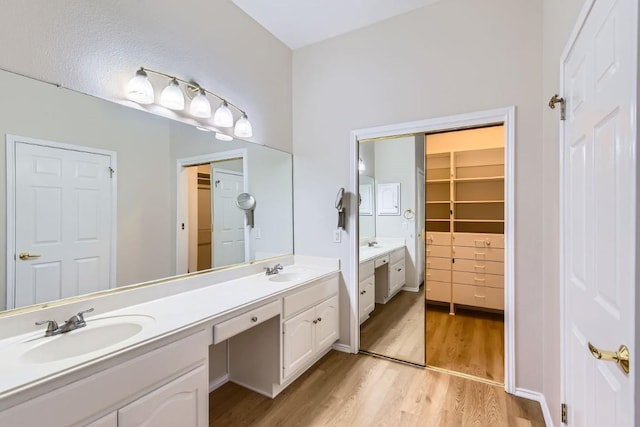 bathroom featuring vanity and hardwood / wood-style flooring