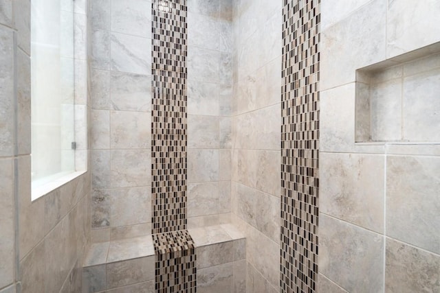 full bath with tiled shower