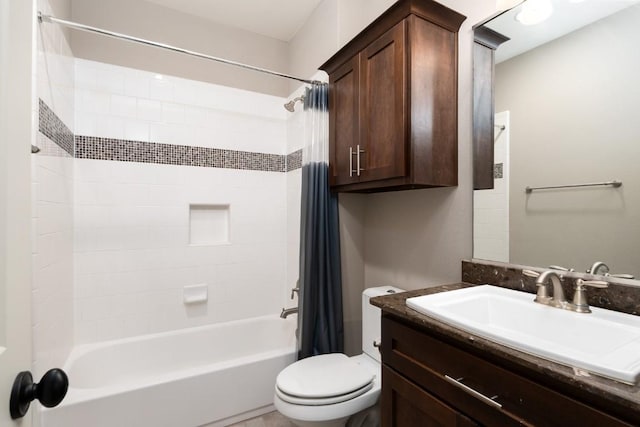 bathroom with toilet, vanity, and shower / bath combo