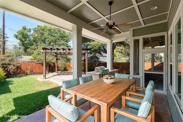 view of patio with ceiling fan, area for grilling, a fenced backyard, and outdoor dining space