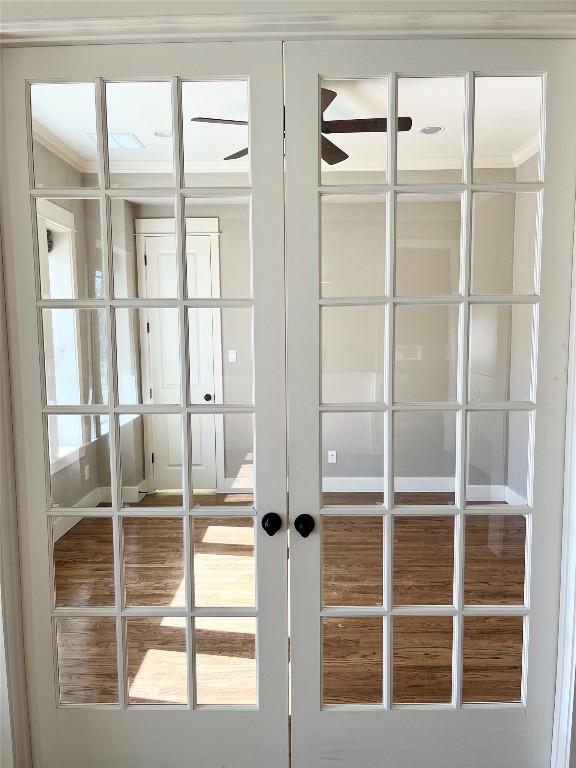 2204 Lindell Ave, Austin, TX 78704 - detailed view of french doors, ornamental molding, and ceiling fan