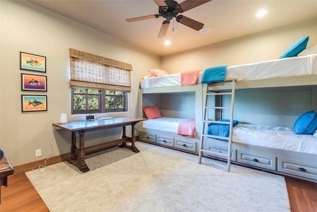 bedroom featuring light hardwood / wood-style flooring and ceiling fan