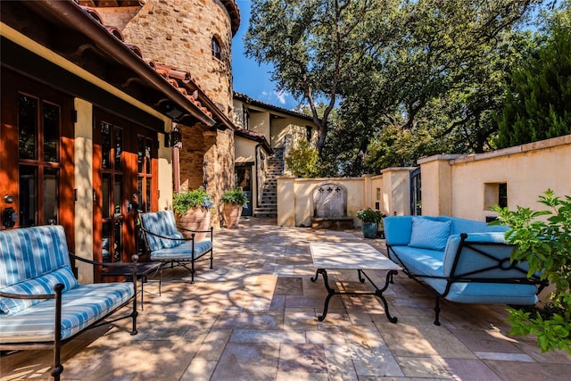 view of patio / terrace with french doors and an outdoor hangout area