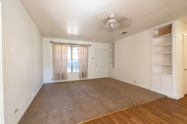 spare room featuring ceiling fan and hardwood / wood-style floors