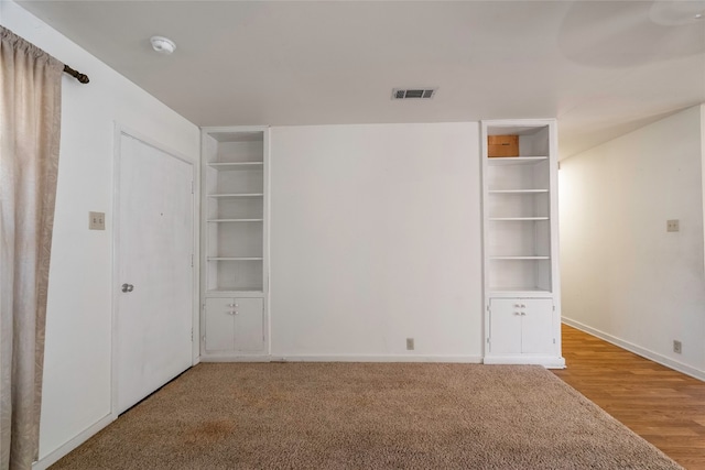 unfurnished bedroom with wood-type flooring