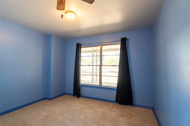 carpeted empty room with ceiling fan