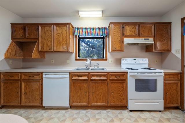 kitchen featuring white appliances and sink