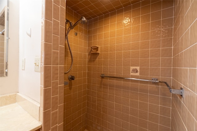 bathroom with tiled shower