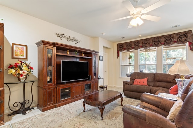 tiled living room featuring ceiling fan