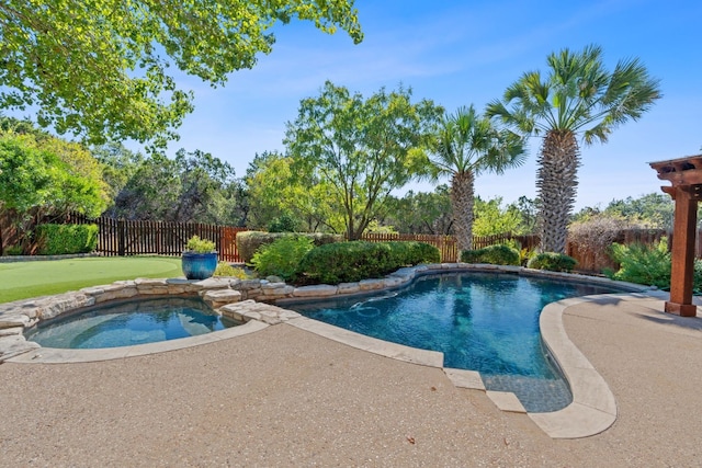 view of pool with an in ground hot tub and a patio