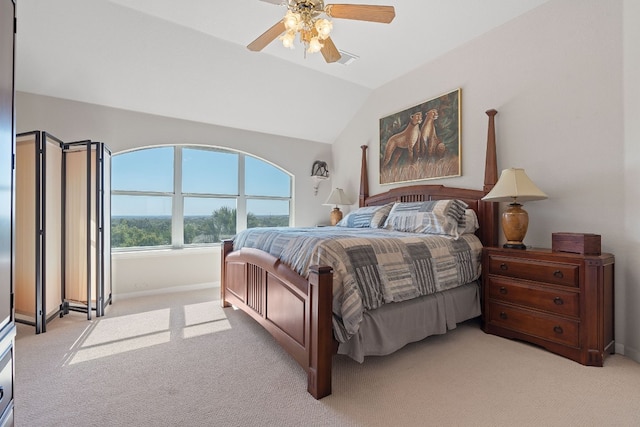 carpeted bedroom featuring ceiling fan and vaulted ceiling