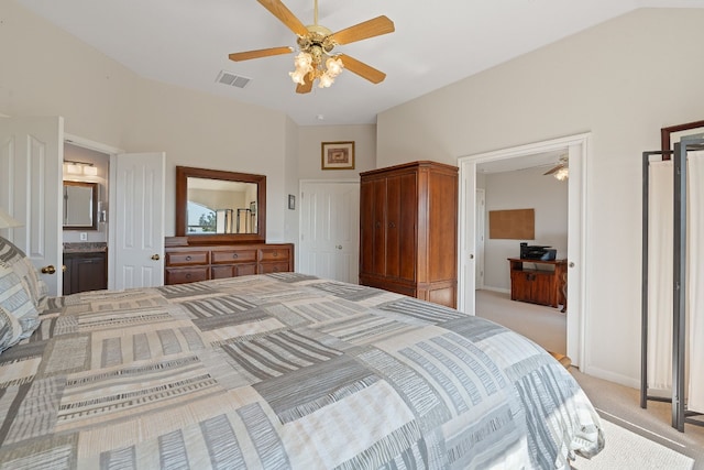 carpeted bedroom featuring ceiling fan, lofted ceiling, and connected bathroom