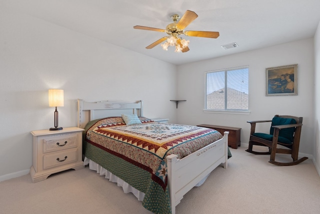 bedroom with ceiling fan and light carpet