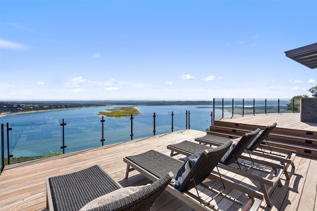 wooden terrace with a boat dock and a water view