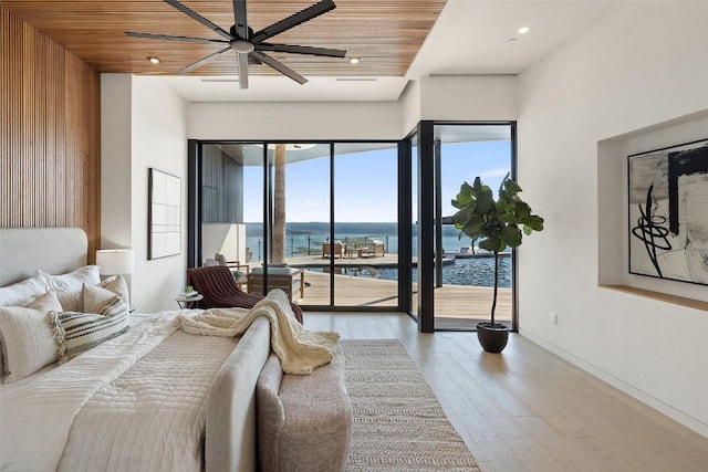 6809 Oasis Pass, Austin, TX 78732 - bedroom with access to outside, light wood-type flooring, a water view, wood ceiling, and recessed lighting