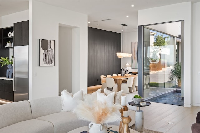 living room with light hardwood / wood-style flooring