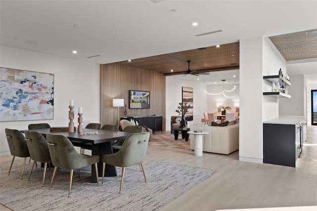 dining room featuring light hardwood / wood-style floors and ceiling fan