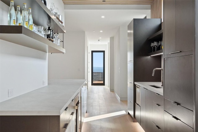 6809 Oasis Pass, Austin, TX 78732 - corridor featuring a sink, recessed lighting, light wood-type flooring, and baseboards