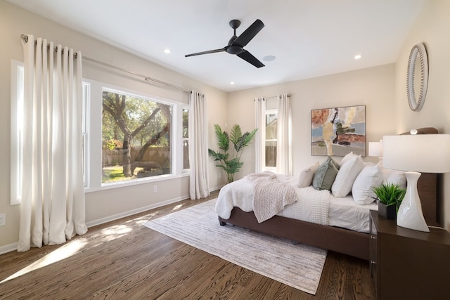 bedroom featuring dark hardwood / wood-style flooring and ceiling fan